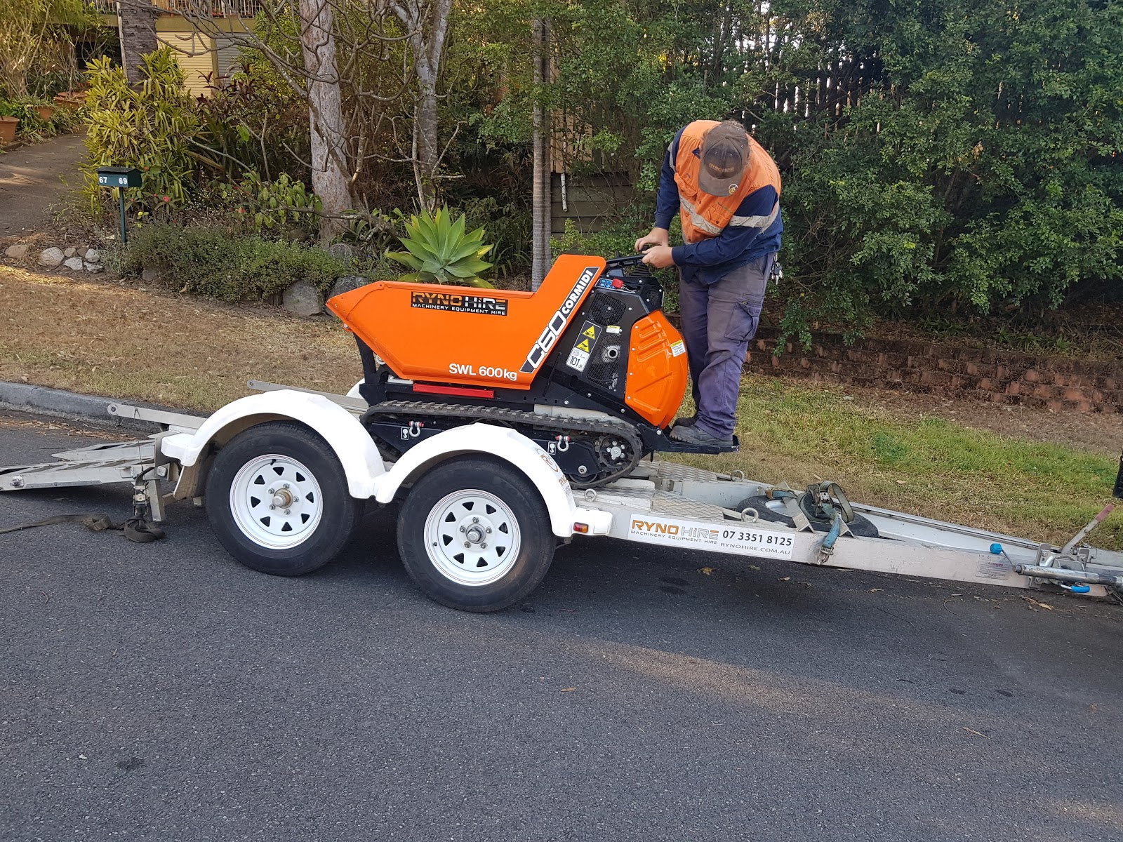 Ryno Hire staff is inspecting an equipment