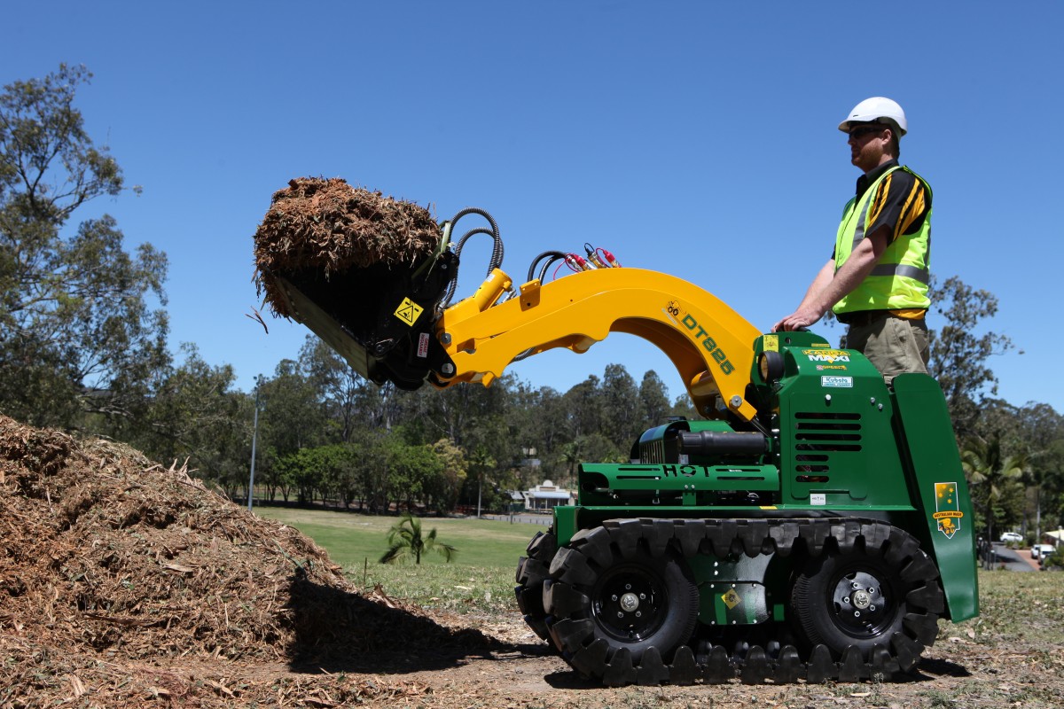 A man is operating a micro loader