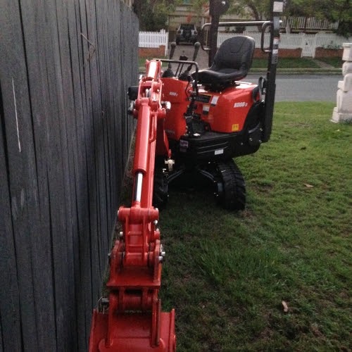 A red one tonne excavator