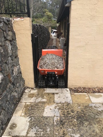 A red mini dumper at a backyard