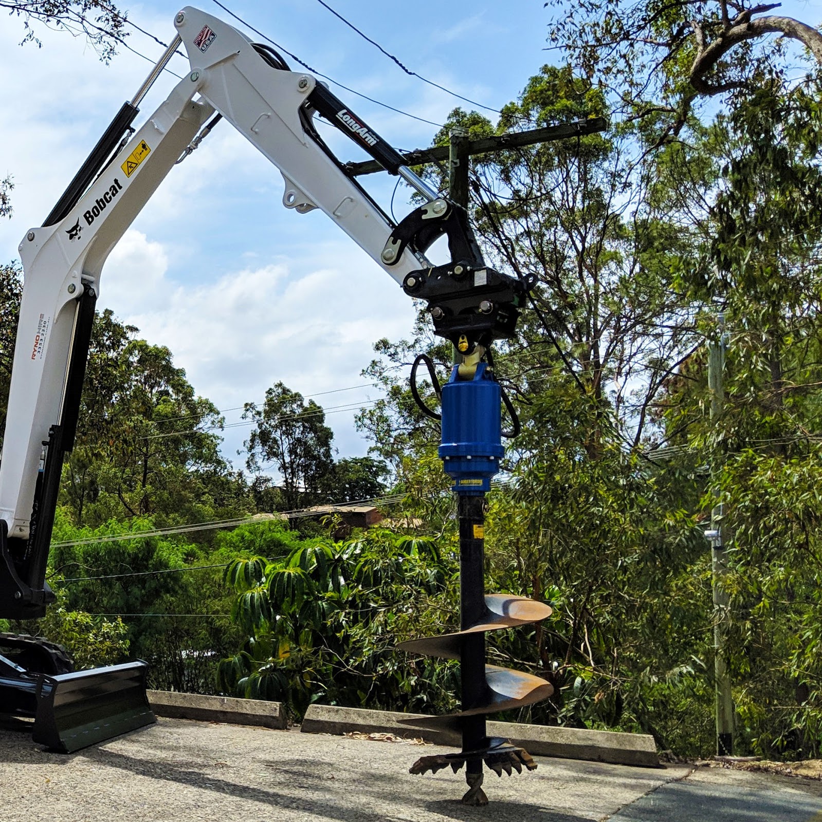 An 3.5 tonne excavator with auger drive attachment