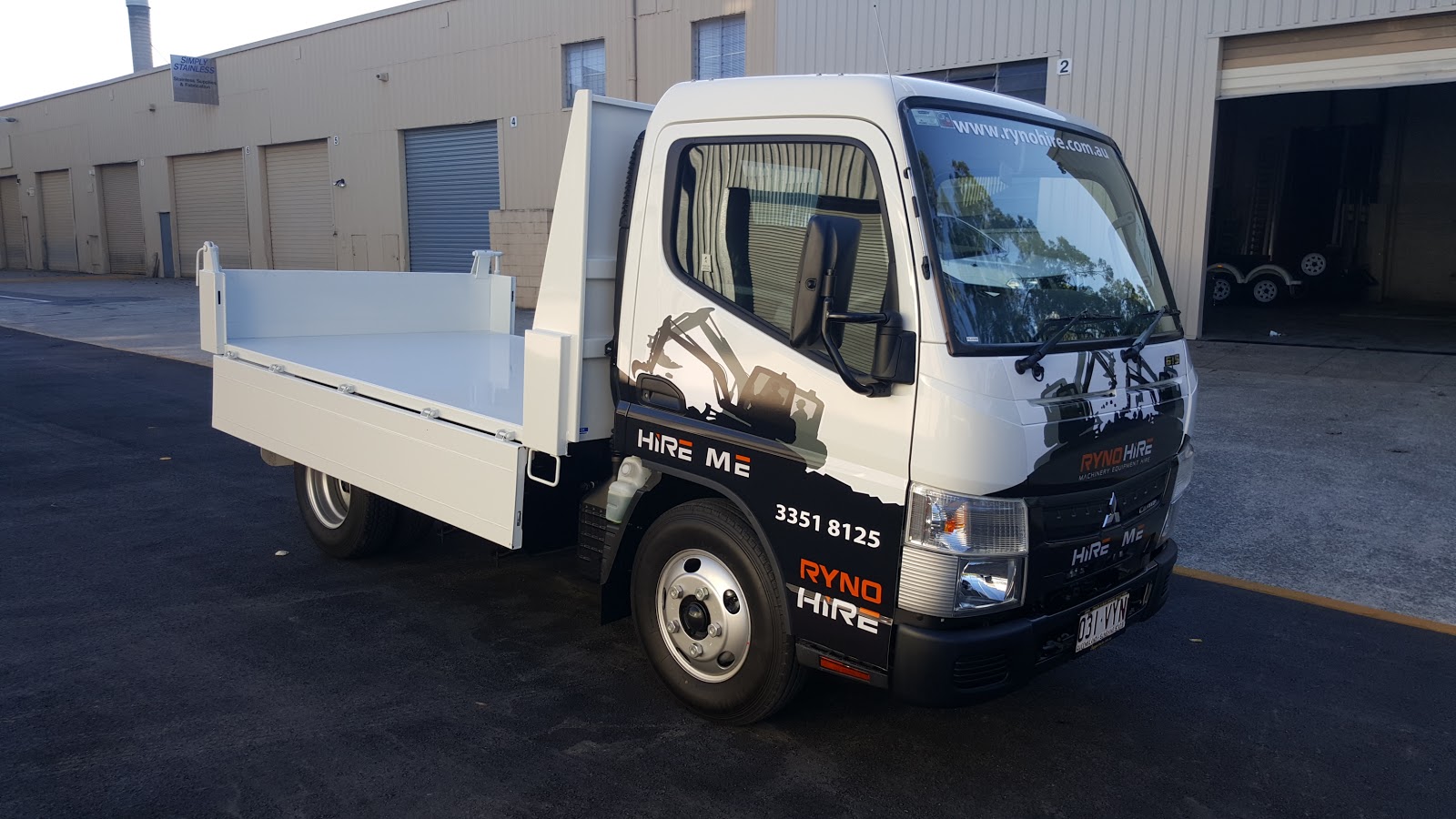 A Ryno Hire truck in front of warehouse